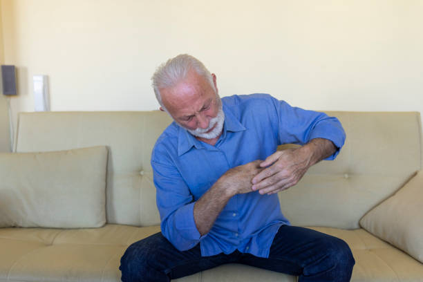istock Lonely Older Man with Chronic Rheumatism is Desperate while Struggling with Insufferable Pain. 1316739326