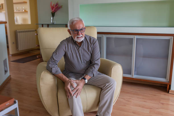 istock An Older Man with Chronic Knee Problems and Pain. 1316740602