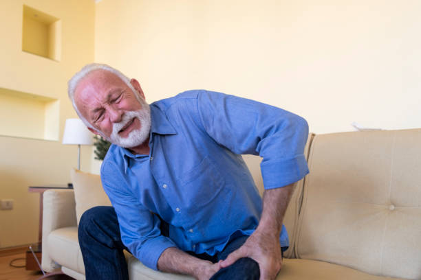 istock An Older Man with Chronic Knee Problems and Pain. 1316740914