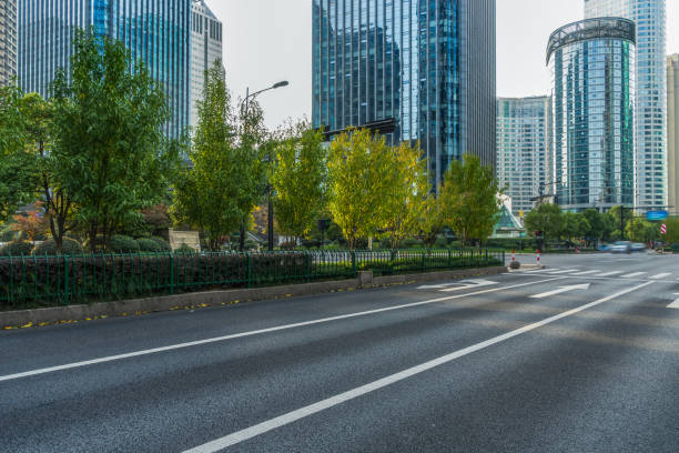 istock empty asphalt road front of modern buildings