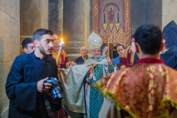 Armenian Patriarch of Jerusalem, in the Holy Sepulchre church Jerusalem, Israel - May 01, 2021: The party of the Armenian Patriarch of Jerusalem, on Holy Saturday (Easter), in the Holy Sepulchre church, Jerusalem, Israel patriarch of jerusalem stock pictures, royalty-free photos & images