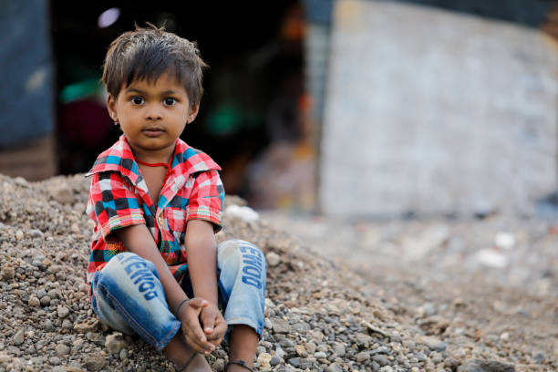 istock indian poor child playing at home 1316743970
