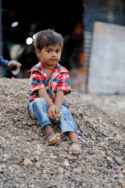 istock indian poor child playing at home 1316743979
