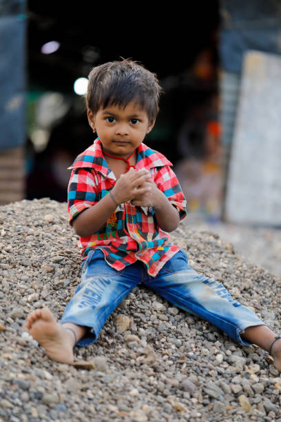 istock indian poor child playing at home 1316743984