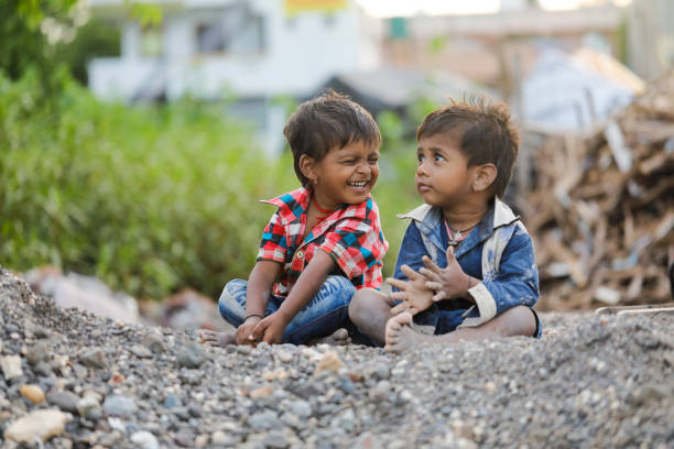 istock indian poor child playing at home 1316743989