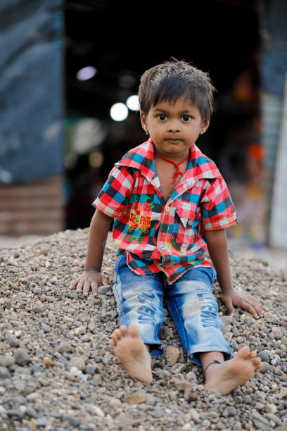 istock indian poor child playing at home 1316744002