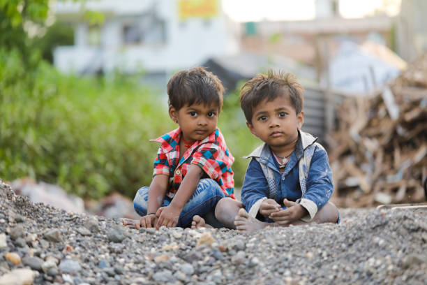istock indian poor child playing at home 1316744003