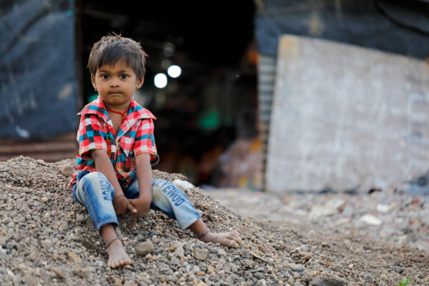 istock indian poor child playing at home 1316744008