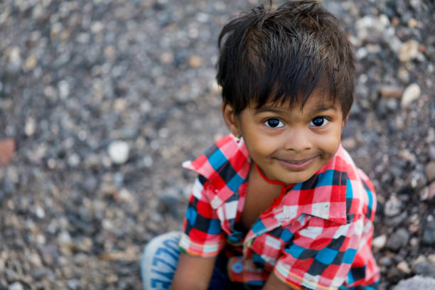 istock indian poor child playing at home 1316744018