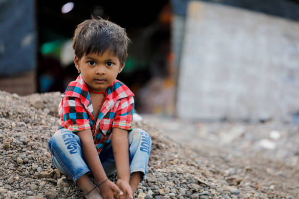 istock indian poor child playing at home 1316744021