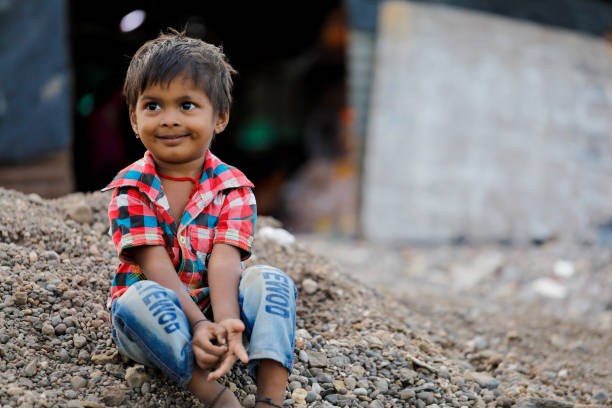 istock indian poor child playing at home 1316744042