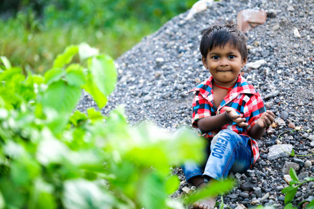 istock indian poor child playing at home 1316744068
