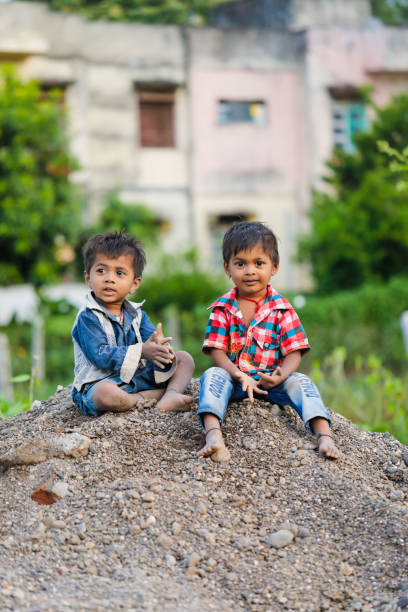 istock indian poor child playing at home 1316744072