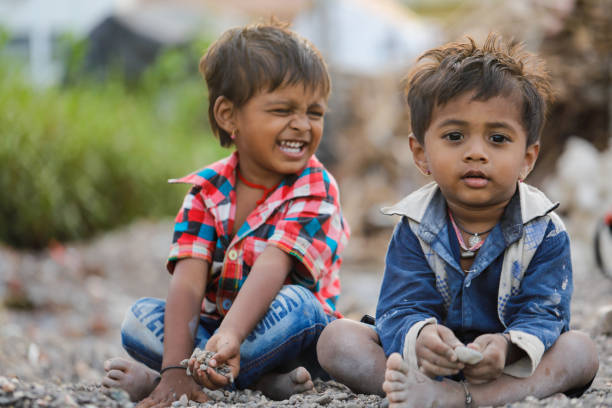 istock indian poor child playing at home 1316744073