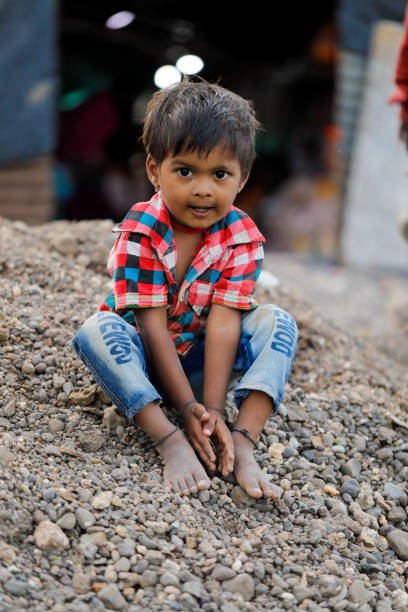 istock indian poor child playing at home 1316744091