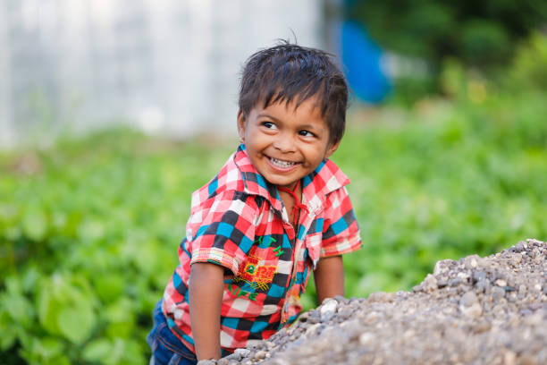 istock indian poor child playing at home 1316744095