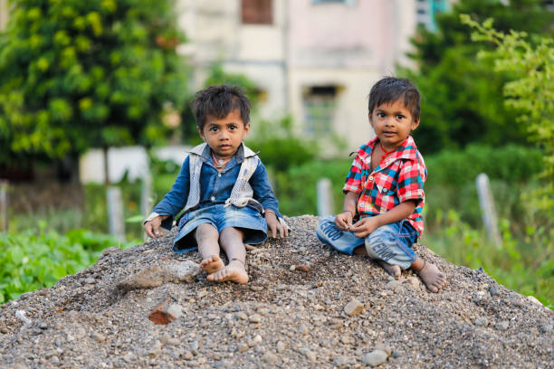 istock indian poor child playing at home 1316744120