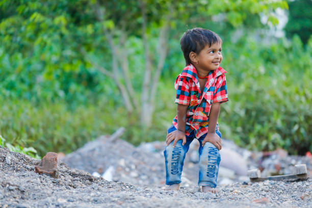 istock indian poor child playing at home 1316744123