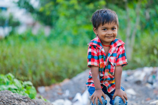 istock indian poor child playing at home 1316744130