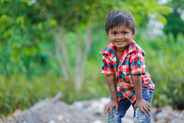 istock indian poor child playing at home 1316744144