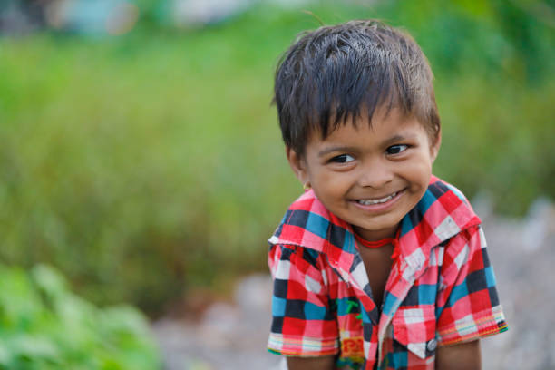 istock indian poor child playing at home 1316744145
