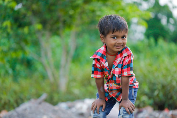 istock indian poor child playing at home 1316744165