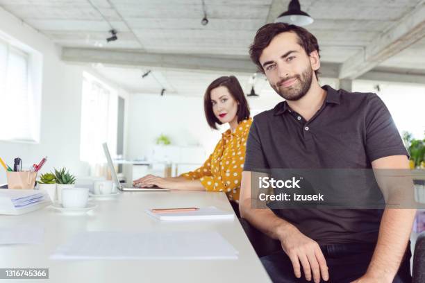 Coworkers In The Office Stock Photo - Download Image Now - Chair, Computer, Portrait