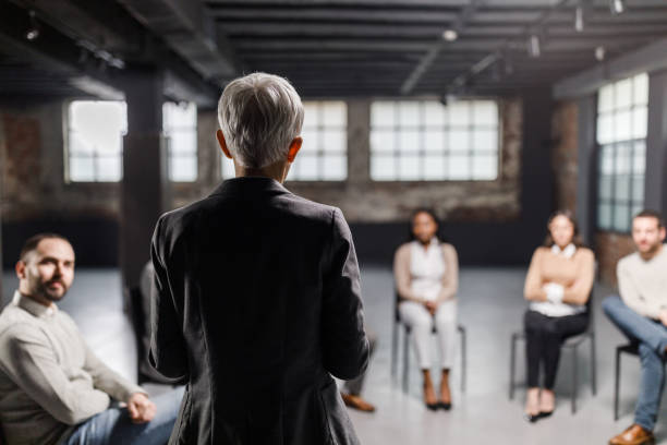 istock Rear view of a psychologist talking on a group therapy. 1316746150