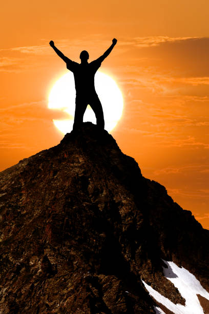 istock man silhouette stay on a mount top 1316748666