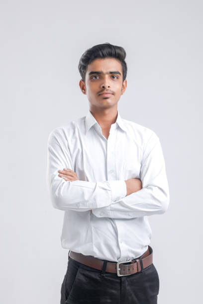 istock Young indian boy in white shirt over white background 1316748921