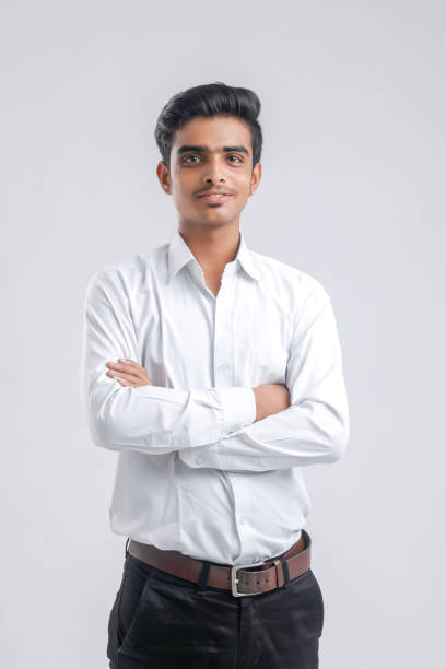 istock Young indian boy in white shirt over white background 1316748931