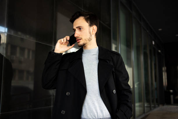istock Handsome business man talking on a cellphone 1316750760