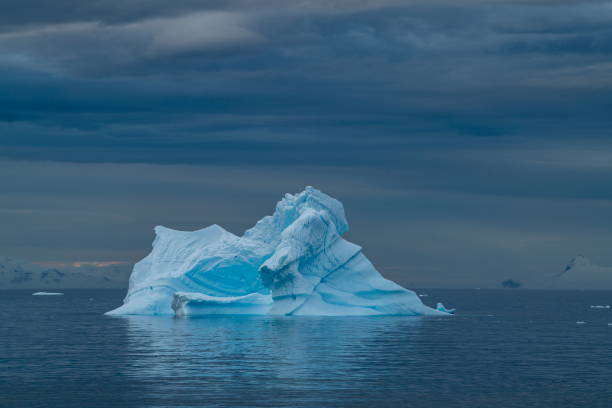 istock A large iceberg seems to glow as it floats under a cloudy sky 1316751432