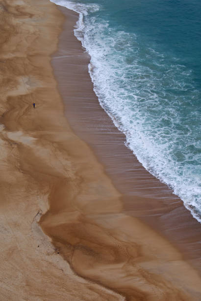 shot of ocean with hills in background