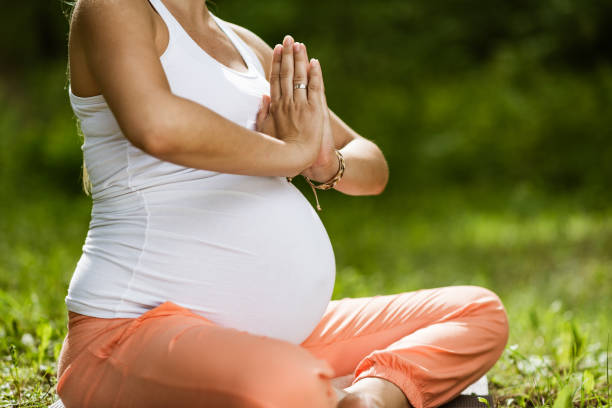 istock Pregnant woman doing yoga 1316752916
