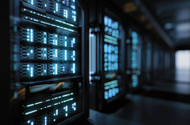 Supercomputer inside a server room data center for cloud computing A large hallway with supercomputers inside a server room data center. Technology used for cloud computing and network security. data center stock pictures, royalty-free photos & images