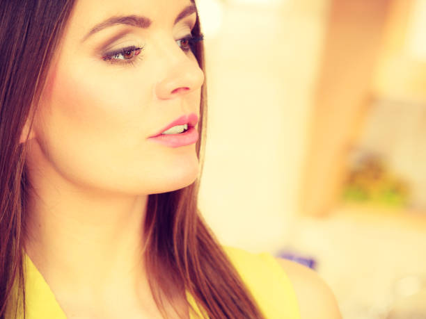 Attractive woman face. Portrait of young long hair female, toned image