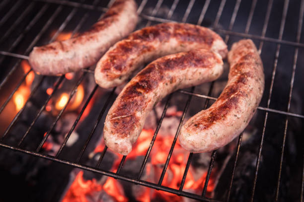 istock Bratwurst  on the grill with flames 1316757251