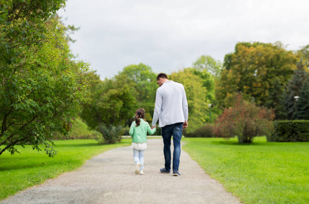 istock happy family walking in summer park 1316757813