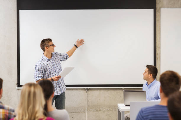 istock group of smiling students and teacher in classroom 1316757888