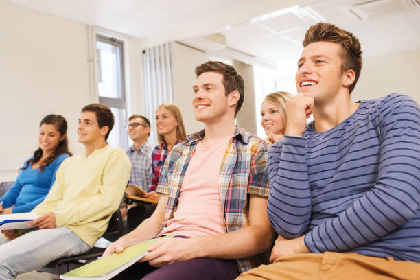 istock group of smiling students in lecture hall 1316758480