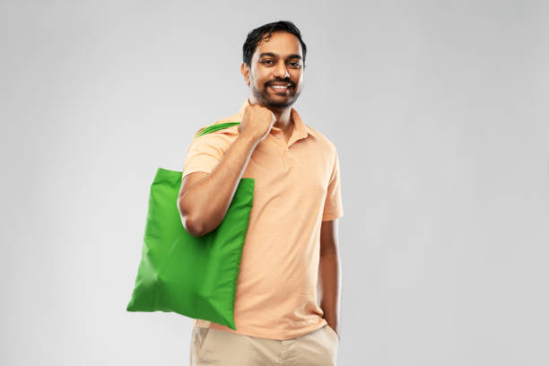 istock man with reusable canvas bag for food shopping 1316758628