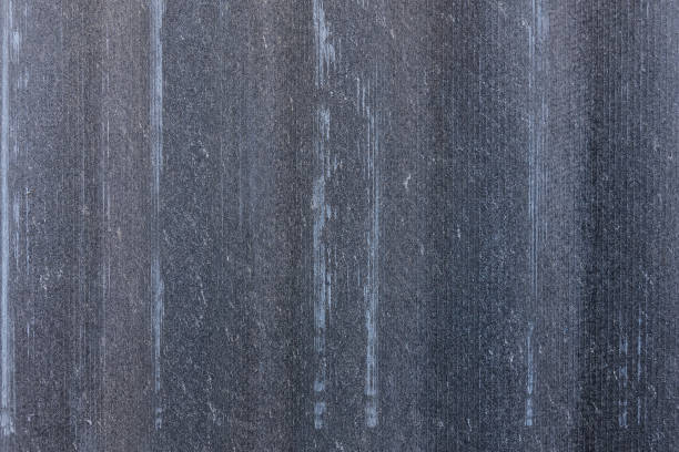 Texture of shabby tiles. Gray wavy panel background stock photo