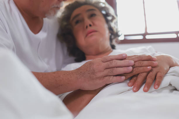 istock Couple Asian elderly have a cough on bed in morning. 1316760016