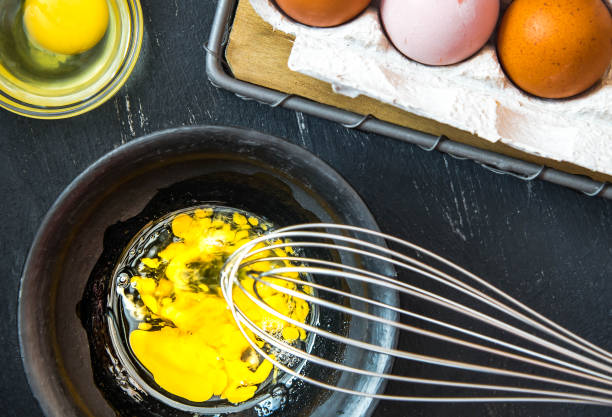 istock Beaten egg yolks in a bowl on a dark background 1316761221