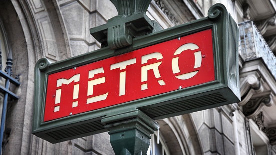 Paris, France - retro metro station sign. Subway train entrance.