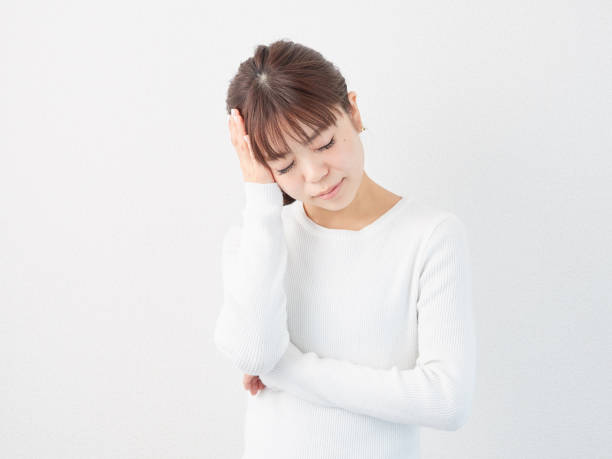 istock Asian woman with a headache 1316765331