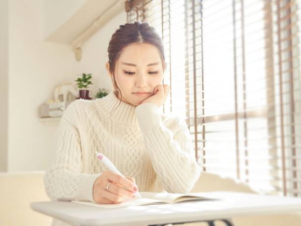 istock Asian women doing school assignments 1316765423