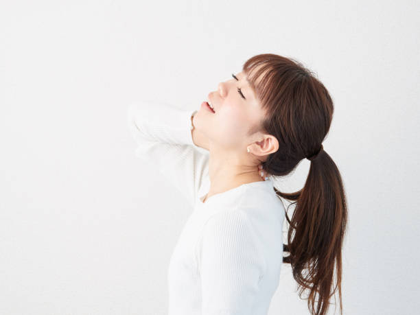 istock Asian woman with a sore neck 1316765653