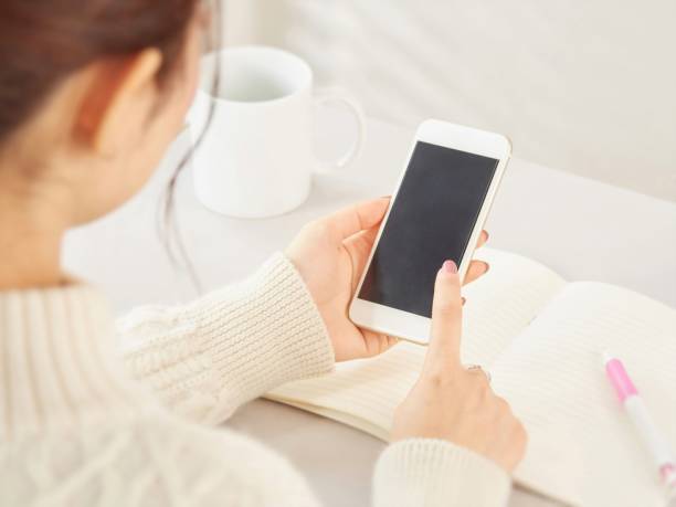 Hands of Asian women using smartphones